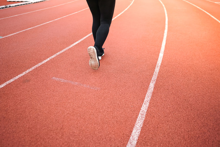 female woman exercise running at sport stadium