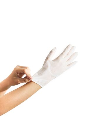 Woman hands wearing rubber glove protection safety covid 19 white backgroundの写真素材