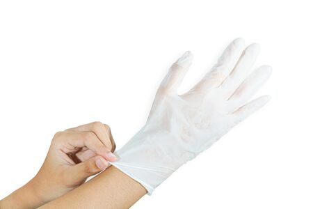 Woman hands wearing rubber glove protection safety covid 19 white backgroundの写真素材