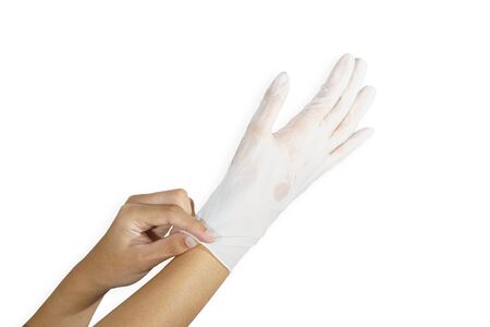 Woman hands wering rubber glove protection safety covid 19 white backgroundの写真素材
