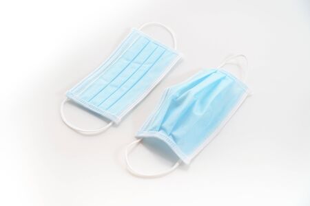 Disposeable blue Hygienic mask on white background protect from virus covid 19 n95 pollutionの写真素材