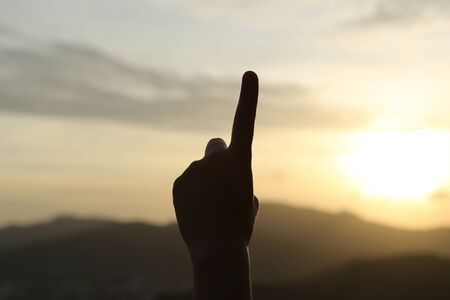 one finger hand language with scenery backgroundsの写真素材