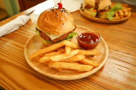 hamburger and chip tomato ketchup dip on wood tableの写真素材