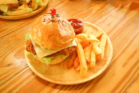 hamburger and chip tomato ketchup dip on wood tableの写真素材