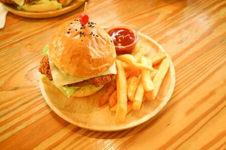 hamburger and chip tomato ketchup dip on wood tableの写真素材