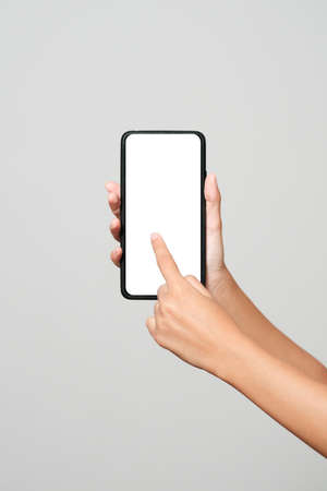 Smartphone mockup. New frameless smartphone mockup with white screen. Isolated on white background. Based on high-quality studio shot. Smartphone frameless design conceptの写真素材