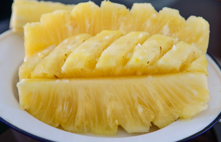 Close-up flesh of a pineapple slice.の写真素材