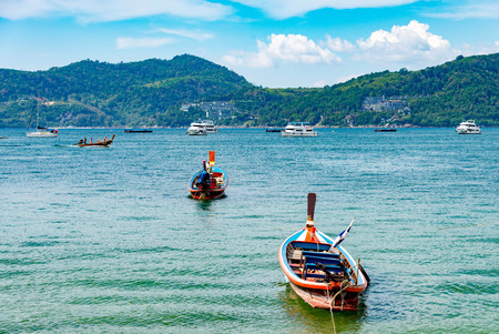 Summer concept,Phuket, Thailand - January 20,2018: colorful of small ship are boarding long tail boat for day tour at Patong beach, Phuket,Thailand.のeditorial素材