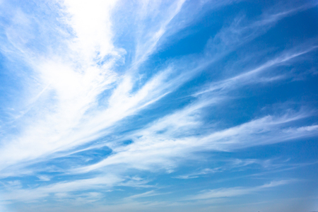 Light blue sky with streak white cloud.の写真素材