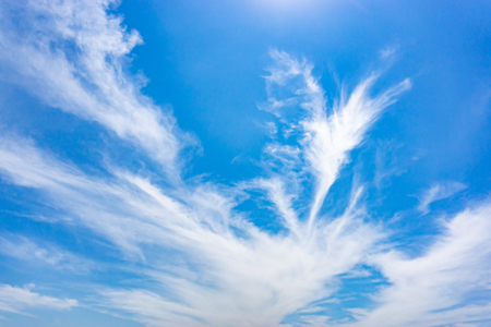 Light blue sky with streak white cloud.の写真素材