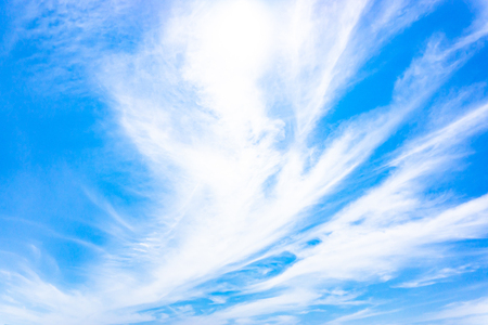 Light blue sky with streak white cloud.の写真素材