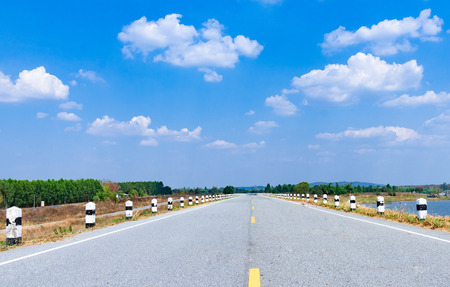 Blue sky background with cloudsの写真素材