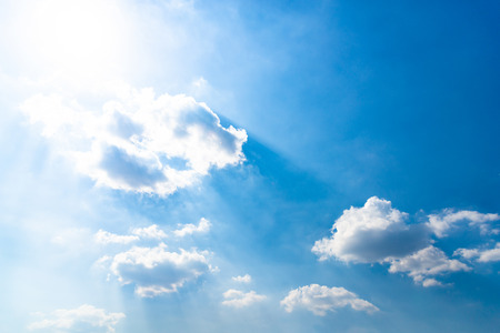 Blue sky background with cloudsの写真素材