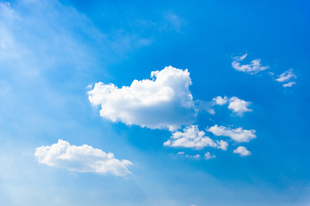 Blue sky background with cloudsの写真素材