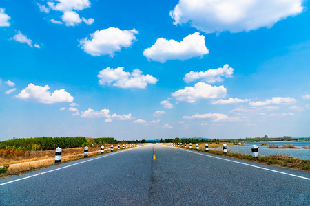 Blue sky background with cloudsの写真素材