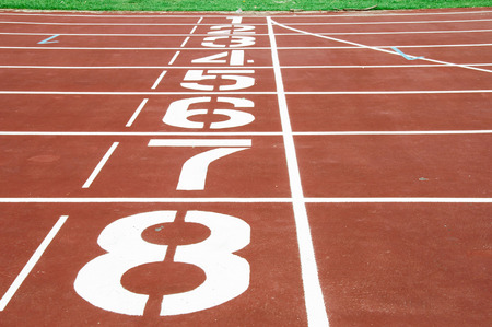 Running track with grass at the stadium