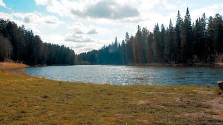 Blue cloudy sky at summer day near lakeの写真素材