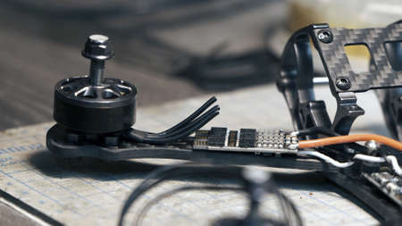 The guy cuts off the extra cable for the FPV drone. Drone assemblyの写真素材