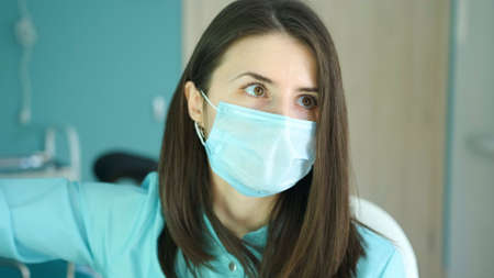 The doctor makes an ultrasound to the patient and looks at the monitorの写真素材