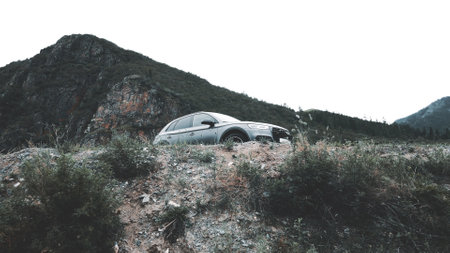 ALTAI, RUSSIA - 29 JUNE 2021: Audi Q5 drone flying back off a cliff footage against the backdrop of a cliff. Altaiのeditorial素材