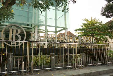 Surakarta, Indonesia - December 22, 2021: A building of Bank Indonesia which is the largest bank and printer of the rupiah currency is located in the city of Solo with unique glass house architectureのeditorial素材