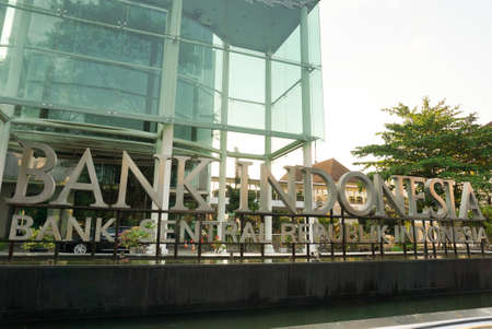 Surakarta, Indonesia - December 22, 2021: A building of Bank Indonesia which is the largest bank and printer of the rupiah currency is located in the city of Solo with unique glass house architectureのeditorial素材
