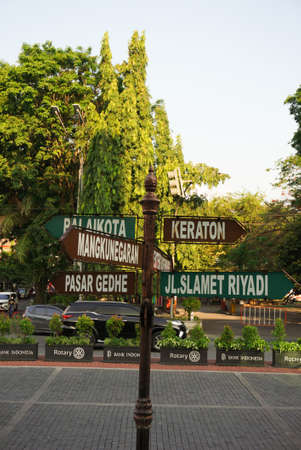 Surakarta, Indonesia - December 23, 2021: A signpost in the Solo city area that shows tourist directions in Surakarta. Beautiful solo city streetsのeditorial素材