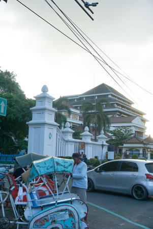 Surakarta, Indonesia â January 1, 2021: Pedicab drivers are hanging out on the road around the Surakarta Kasunanan Palace waiting for tourist passengers. Suitable for websites, news, travelのeditorial素材