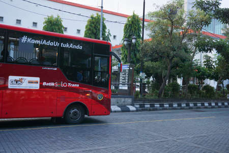 Surakarta, Indonesia â December 20, 2021: A public transportation in the city of Solo called BST (Batik Solo Trans) which serves to transport passengers from one bus stop to another. Perfect for newsのeditorial素材