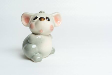 gray piggy bank toy made of porcelain glass mouseの写真素材