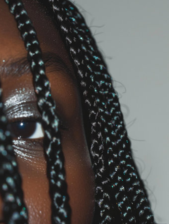 Beautiful african american woman with braids, studio shotの素材