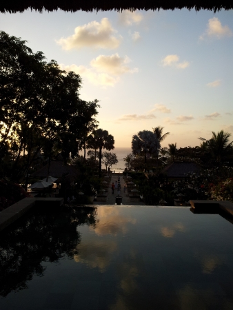 Reflection over water over sunsetの写真素材