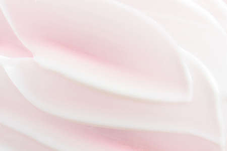 Cosmetic cream close-up. Macro photo. The concept of cosmetic products, skin and hair care, beauty and health. Background image in trendy pink.の写真素材