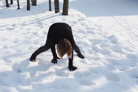 After a snowstorm in Hokkaido, tourists who are not used to walking on snow fall easily.の写真素材