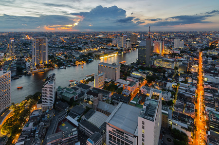 Bangkok cityscape and Chaophraya River with cloud at twilightの写真素材