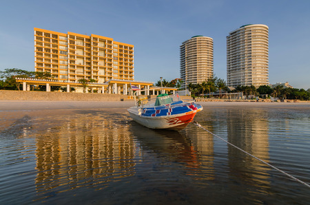 boat on Huahin beach with reflectionの写真素材