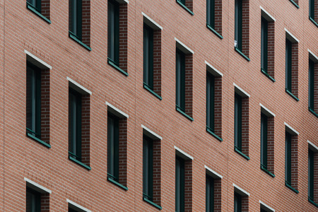 Brick wall and window pattern as backgroundの写真素材