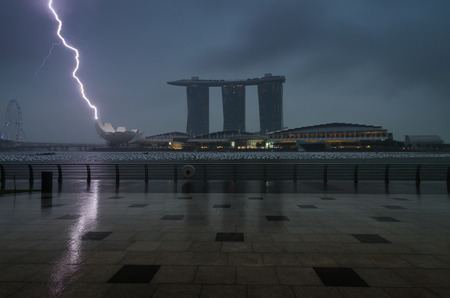 Marina bay sands with clouds and thunder lightnings and storm in Singaporeのeditorial素材