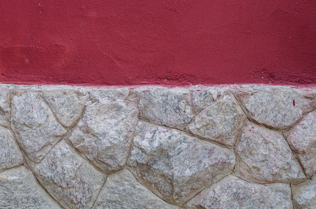 Rock wall with red texture wall aboveの写真素材