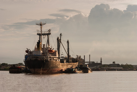 Ship in Choa Praya river, Bangkok Thailand at sunset timeの写真素材