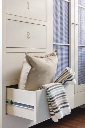 bath towel and pillow in wardrobe at homeの写真素材
