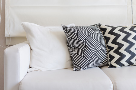 black and white pillows on sofa in living roomの写真素材