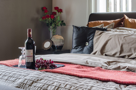 black bed in bedroom design with wine at homeの写真素材