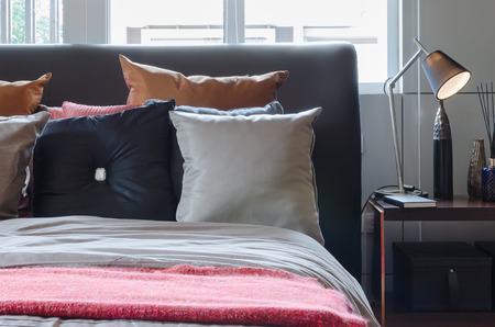 black bed in bedroom design at homeの写真素材