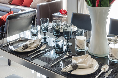 black dinning table with table set in dinning roomの写真素材