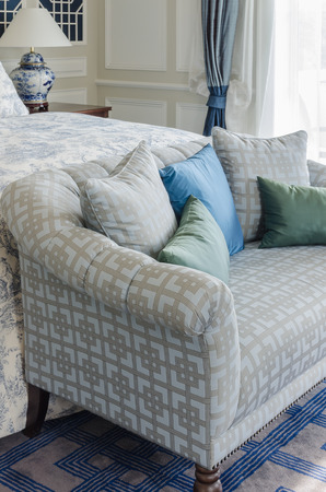 blue and green pillow on sofa bed in luxury bedroomの写真素材