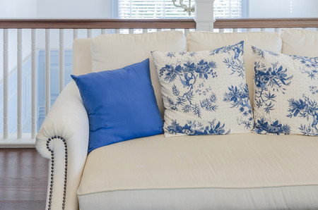 blue pillow on beige sofa in luxury living room at homeの写真素材