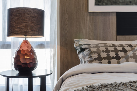brown lamp on round table in bedroomの写真素材