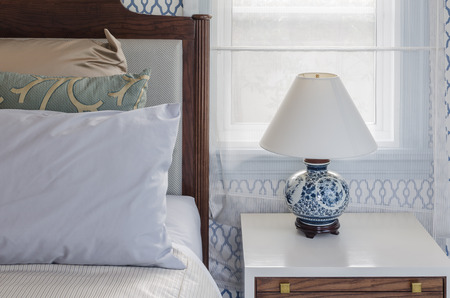 chinese lamp style on white table side in luxury bedroomの写真素材
