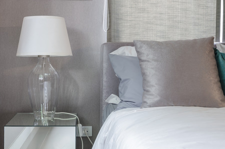clean modern bedroom with white lamp at homeの写真素材